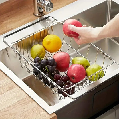Égouttoir vaisselle rétractable inox avec fruits sur lavabo